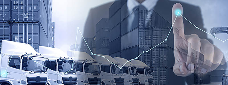 Trucks and shipping containers with overlay of business man touching point in line graph
