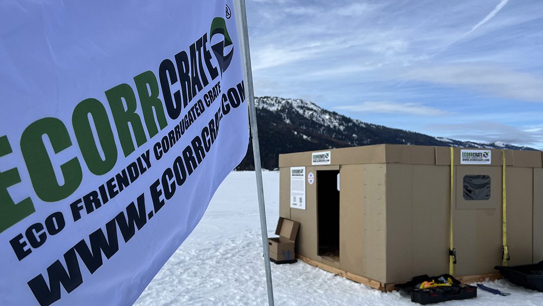 Ecorrcrate® flag next to an ice hut made of Ecorrboard® for ice fishing on a frozen lake